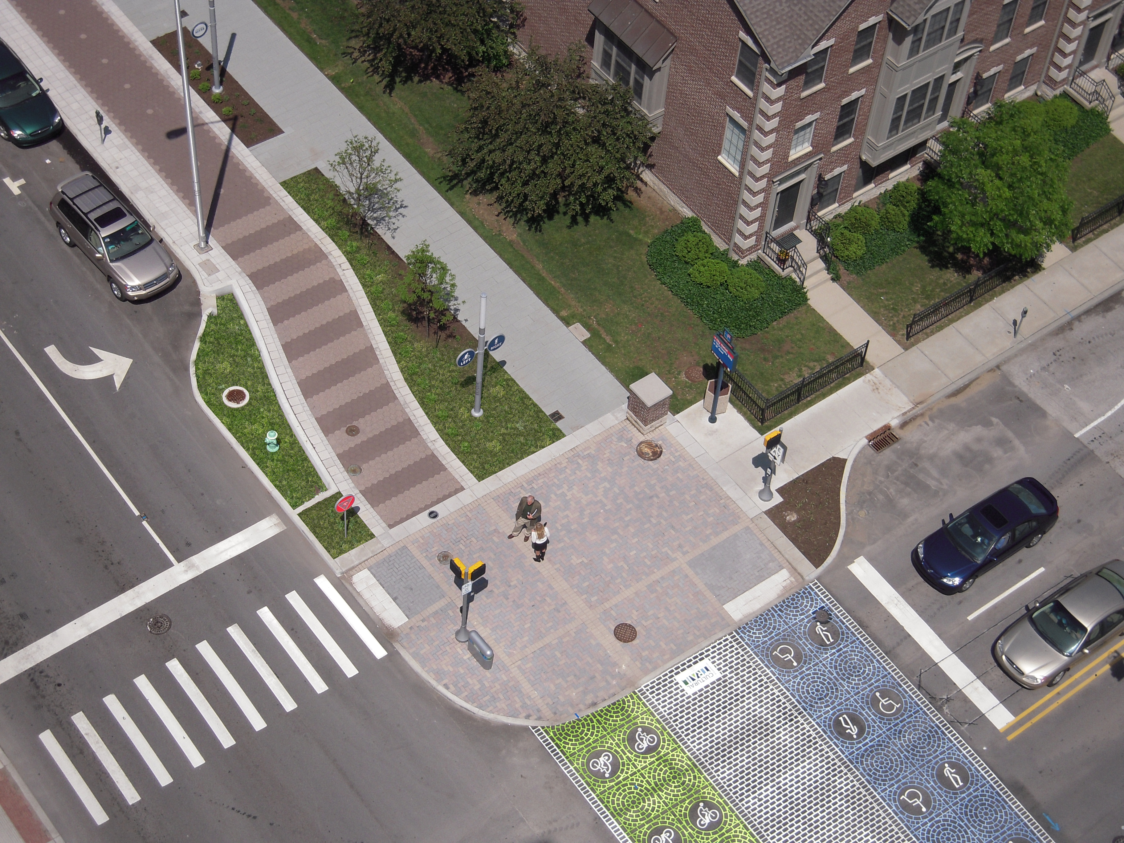 The design team bumped out the curbs to reduce crossing distances and used special pavement markings in the crosswalk.