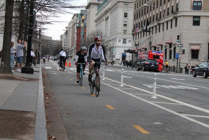 Bicyclists using the 15th Street cycle track, between E Street and Pennsylvania Ave.