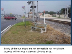 Wide driveway creates pedestrian-motor vehicle conflict area.